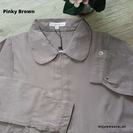 a pair of scissors sitting on top of a cloth