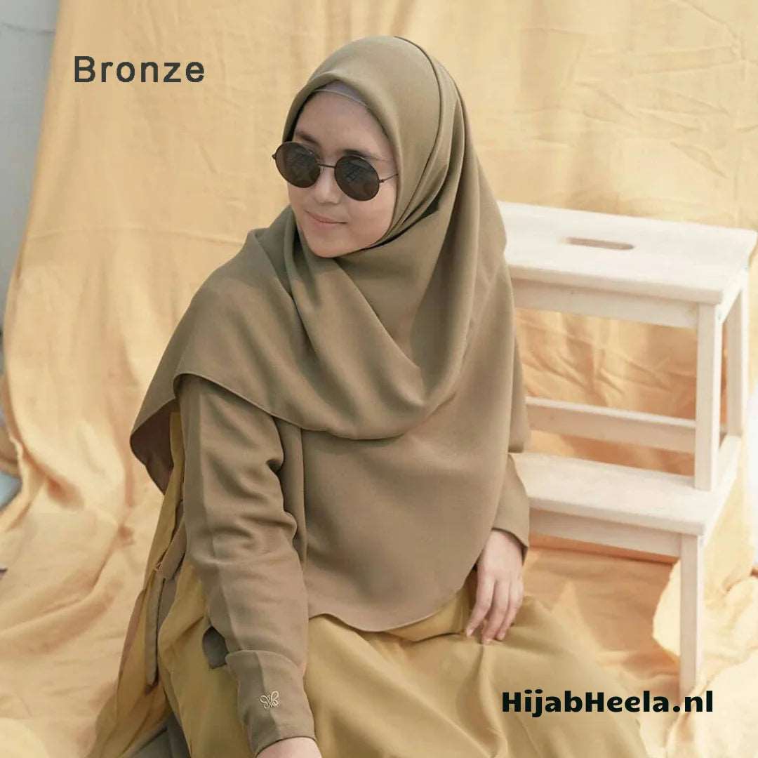 a man in sunglasses is sitting on a wooden bench