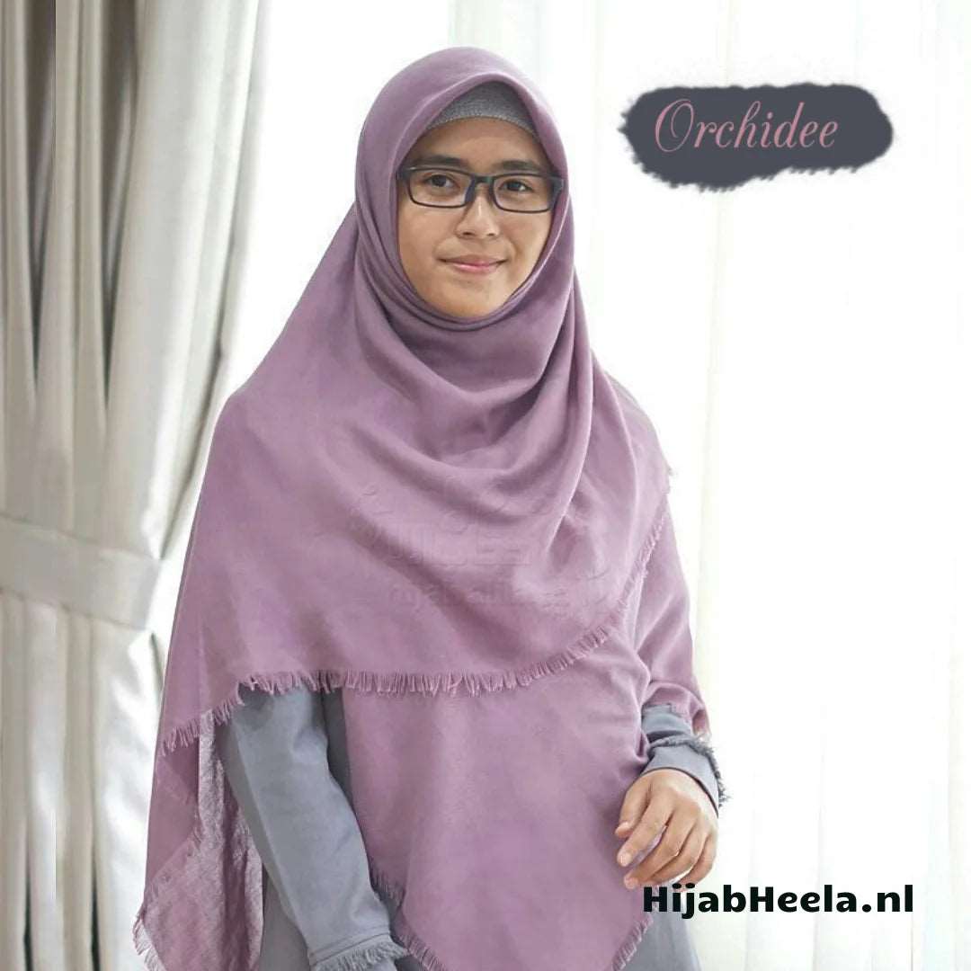 a woman in a pink dress holding a teddy bear