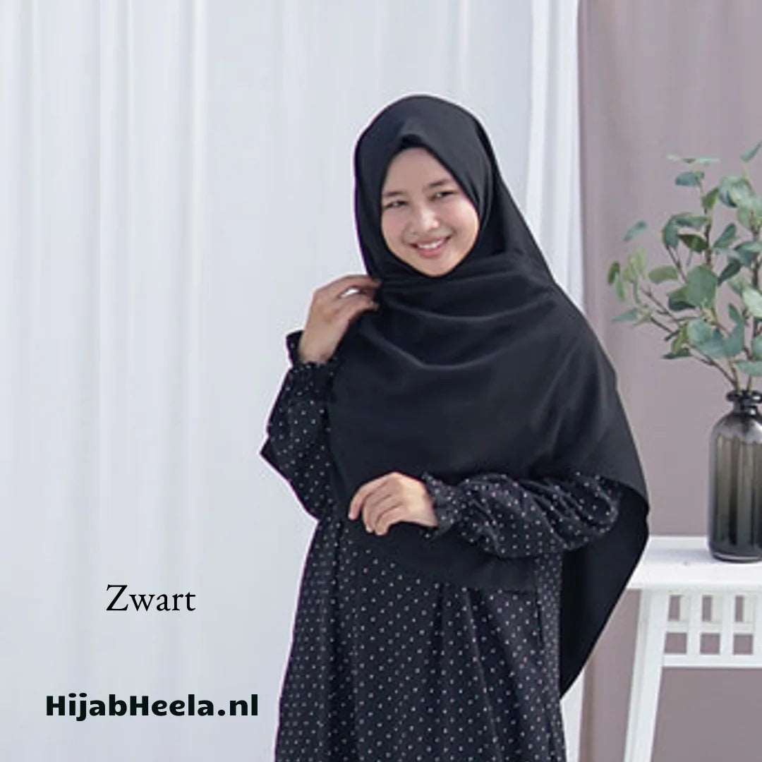 a woman standing in front of a white refrigerator