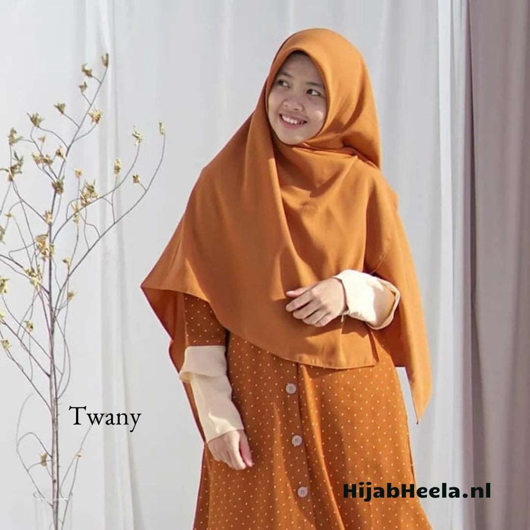 a woman in a coat is holding a cell phone