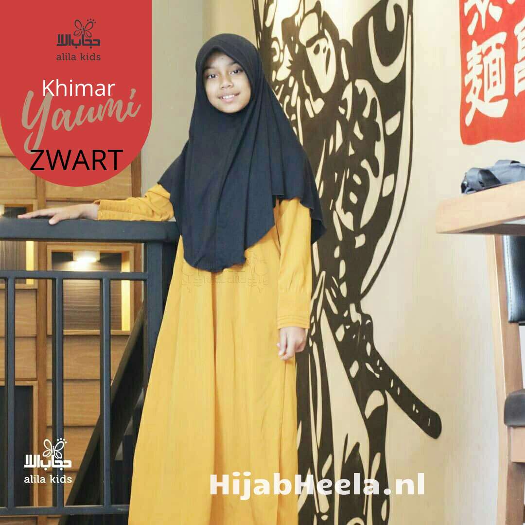 a woman standing next to a pair of skis