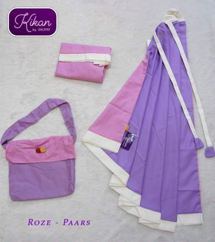 a purple bed with purple sheets and pink sheets 